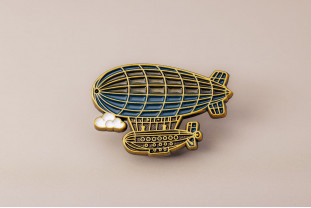 Pin’s dirigeable en métal antique – Impact Émotion